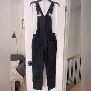 Fitted cross back stretch denim overalls. Size M